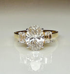 Oval Lab Grown Diamond Engagement Ring: 14K Gold Three Stone Emerald Accents
