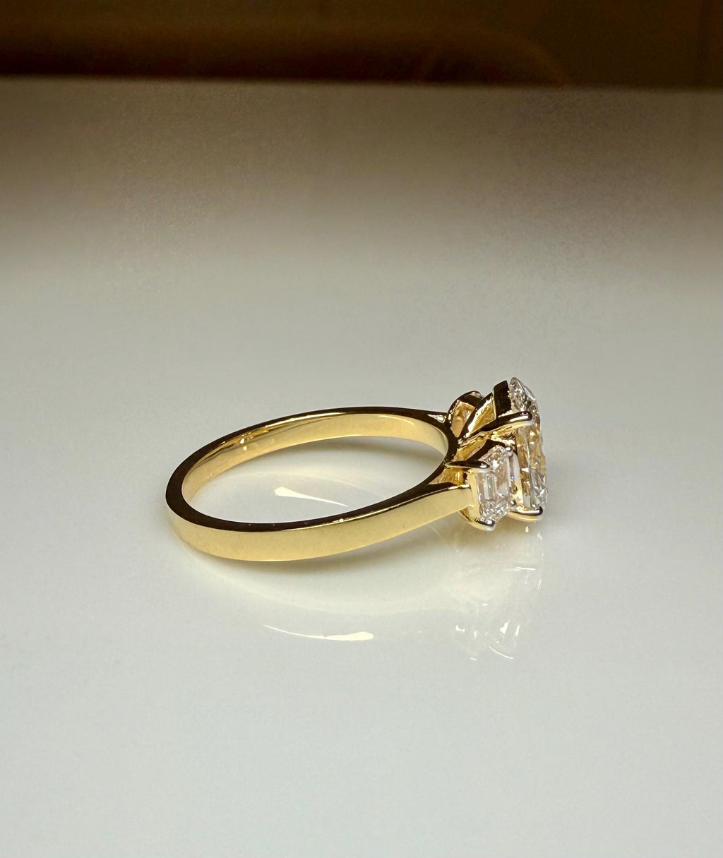 Oval Lab Grown Diamond Engagement Ring: 14K Gold Three Stone Emerald Accents