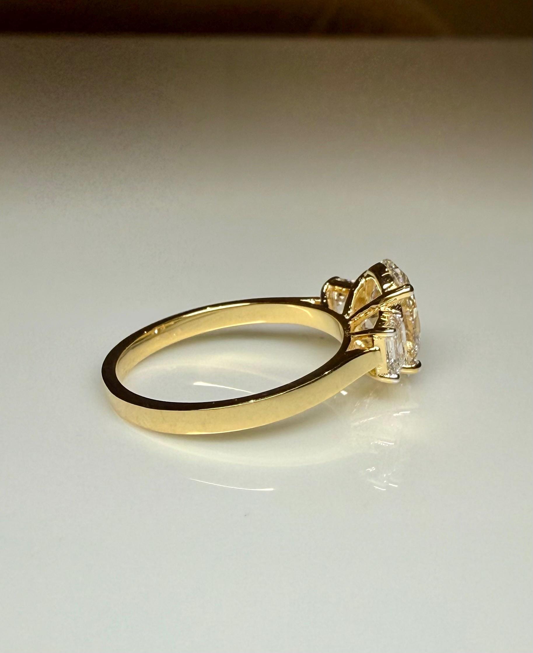 Oval Lab Grown Diamond Engagement Ring: 14K Gold Three Stone Emerald Accents