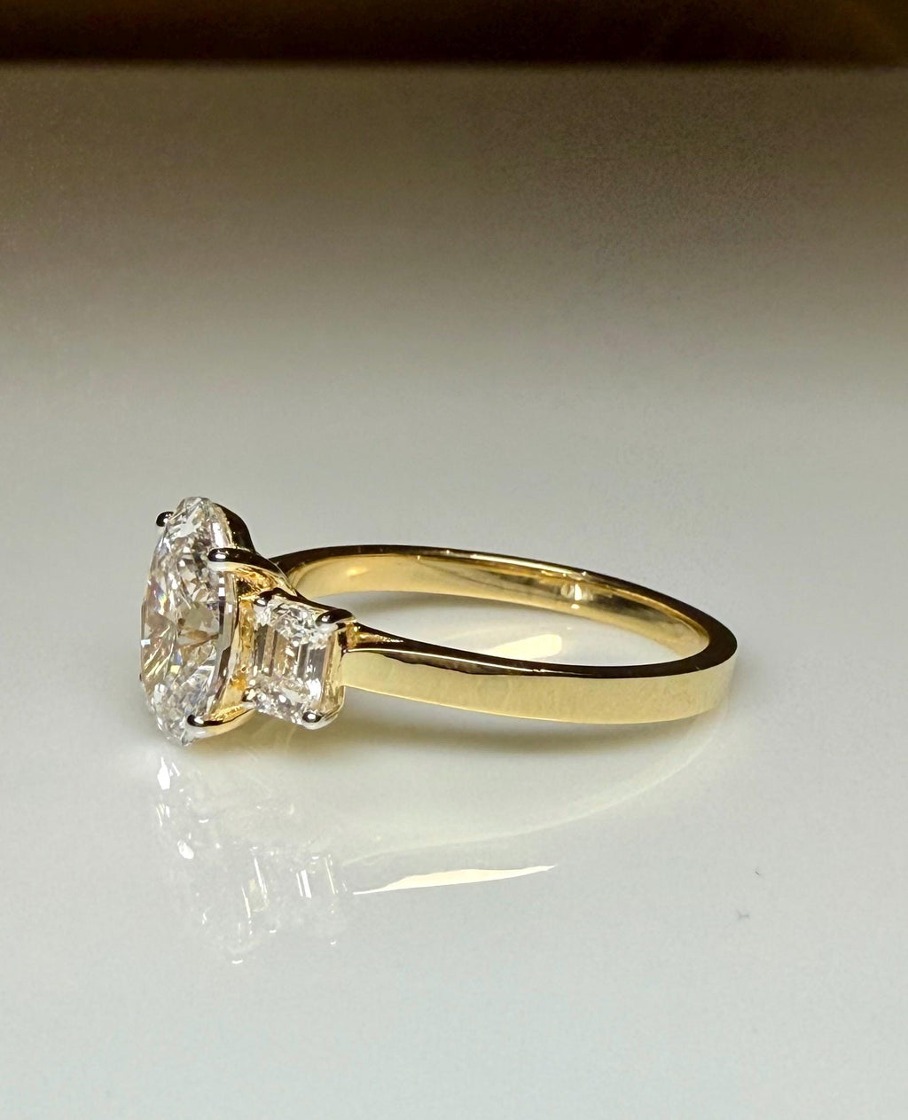 Oval Lab Grown Diamond Engagement Ring: 14K Gold Three Stone Emerald Accents