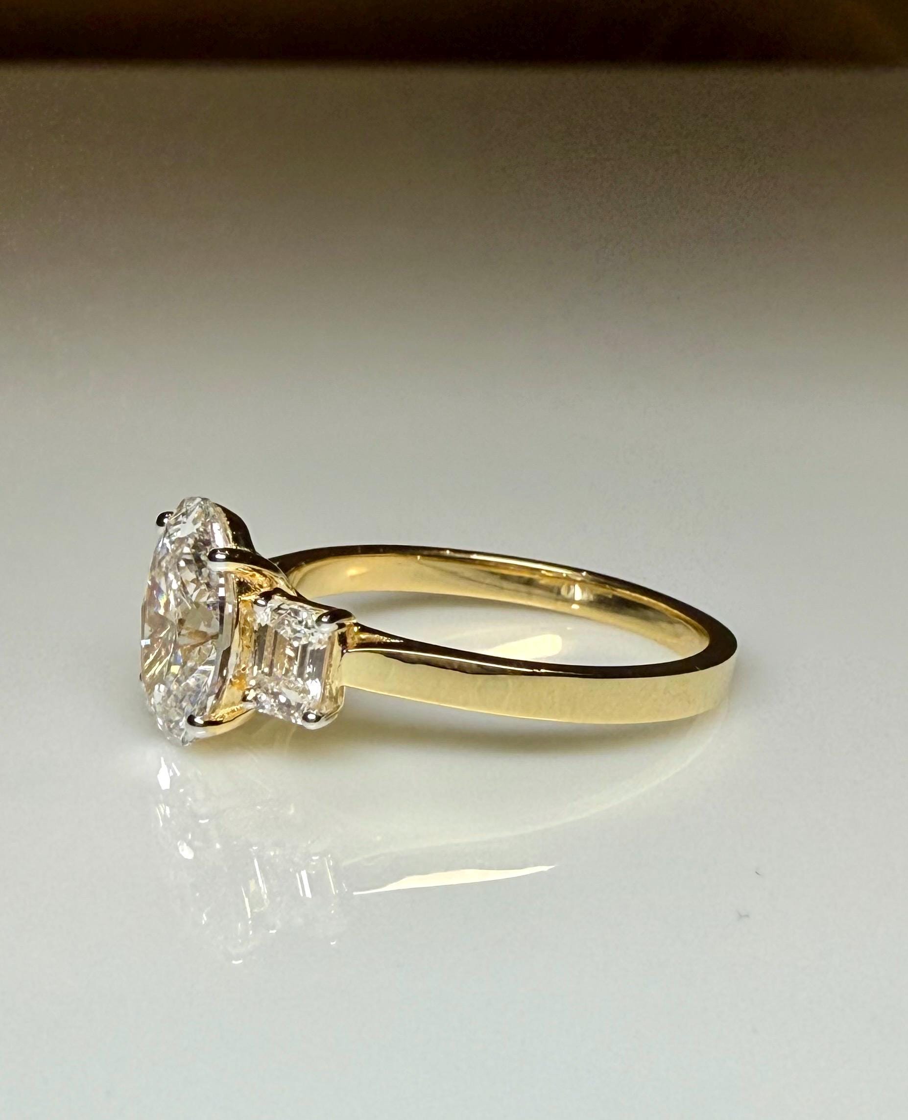 Oval Lab Grown Diamond Engagement Ring: 14K Gold Three Stone Emerald Accents