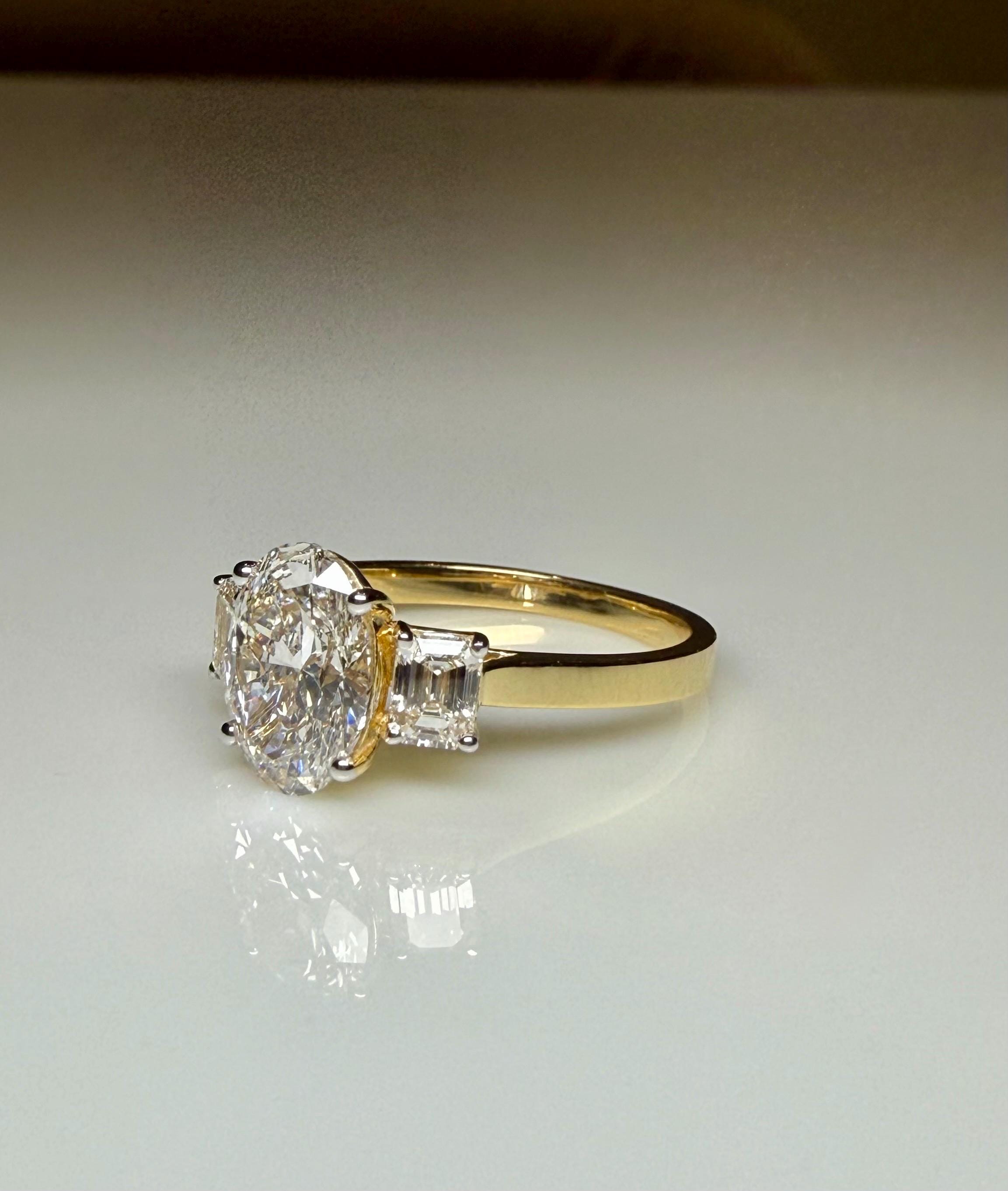 Oval Lab Grown Diamond Engagement Ring: 14K Gold Three Stone Emerald Accents