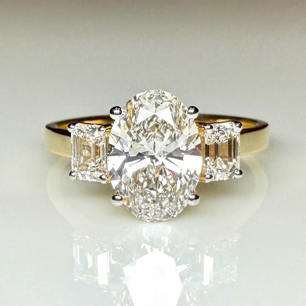 Oval Lab Grown Diamond Engagement Ring: 14K Gold Three Stone Emerald Accents