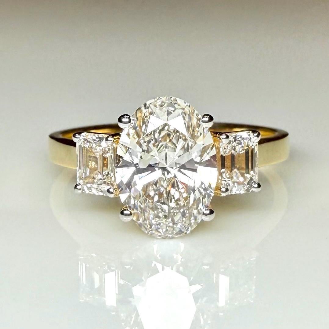 Oval Lab Grown Diamond Engagement Ring: 14K Gold Three Stone Emerald Accents